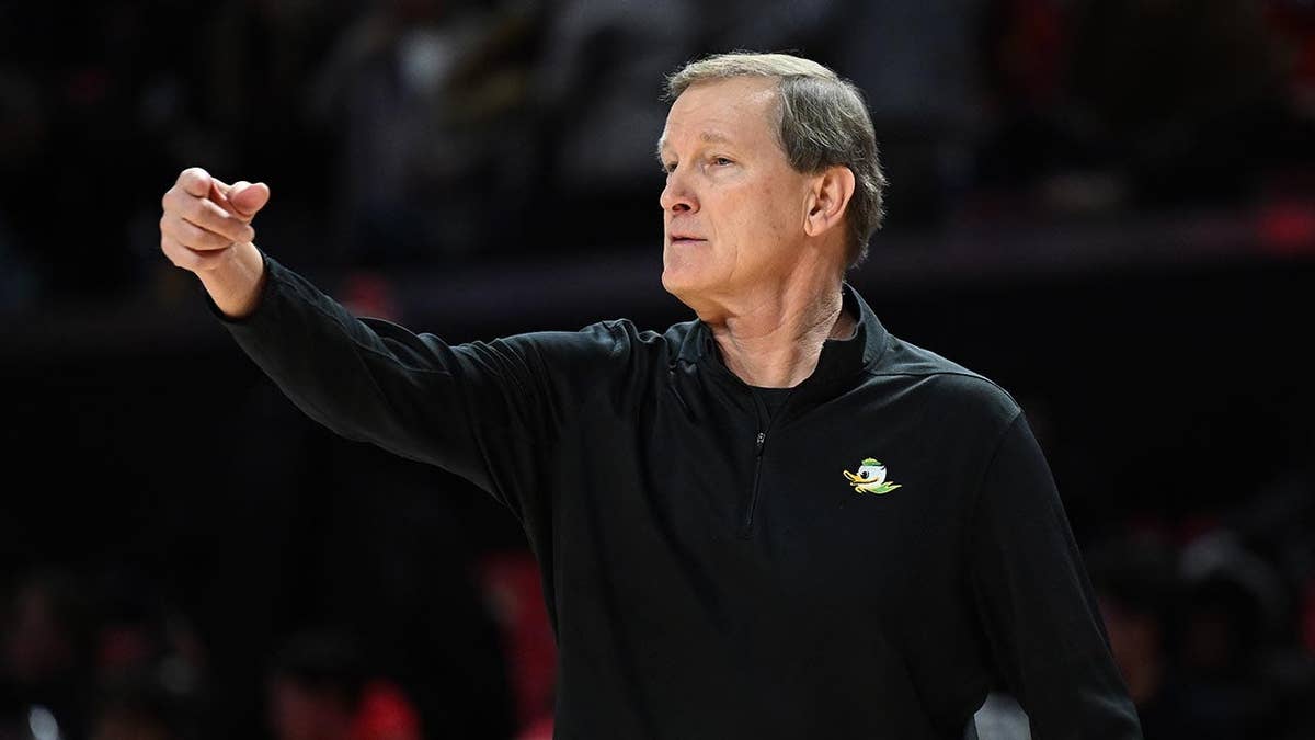 Dana Altman watches the game from the sideline at Xfinity Center.