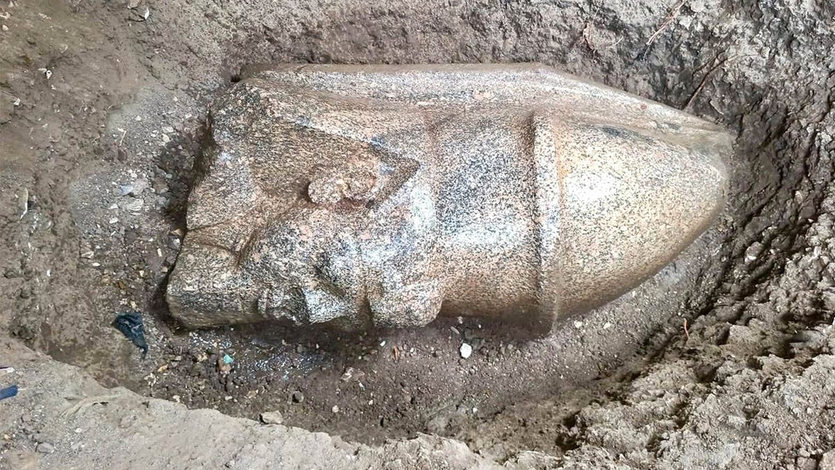 View of ramses ii statue in ground