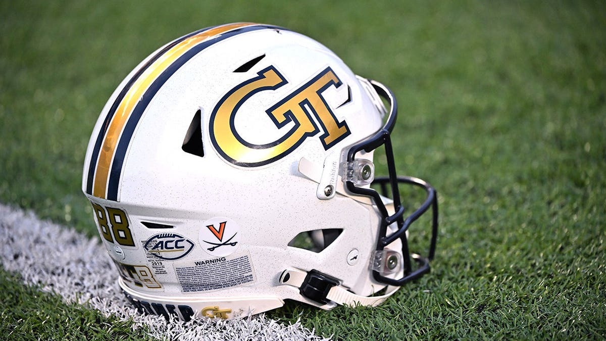 Georgia Tech player's helmet displays a University of Virginia sticker honoring three Virginia football players killed in a shooting