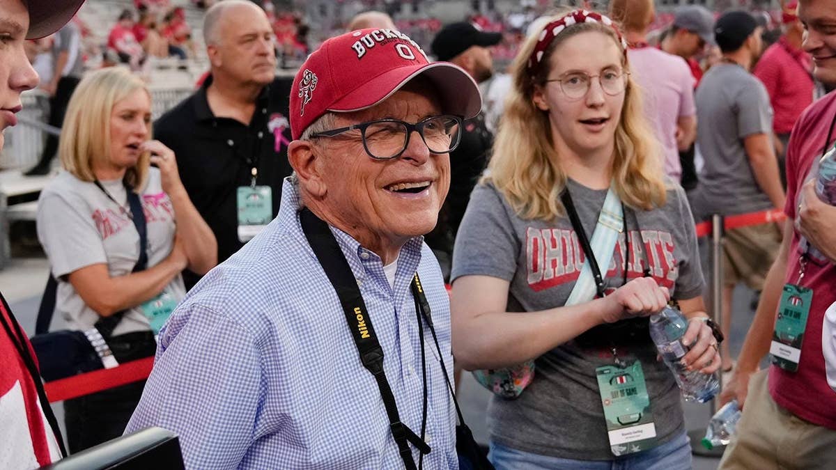 Ohio Gov. Mike DeWine standing on the sideline at Ohio Stadium