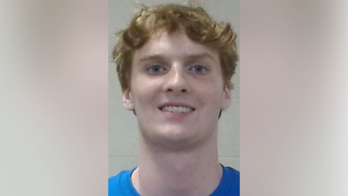 James Vandenberg, a Wichita State University student arrested on a sexual assault charge, appears in a booking photo wearing a blue shirt.