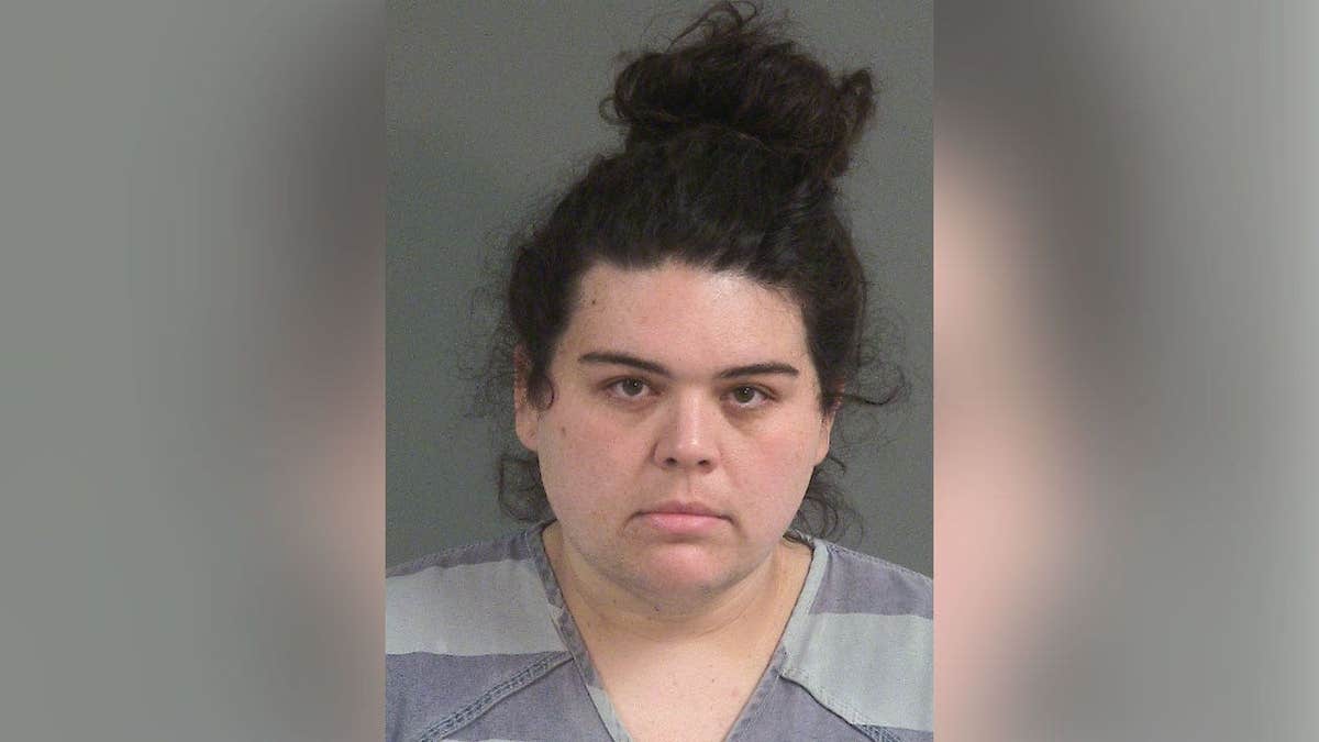 Justine Marie May in a booking photo