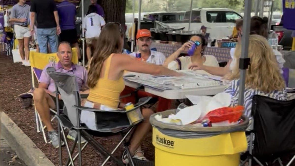 Tailgaters play Mahjong outside Tiger Stadium on the campus Louisiana State University