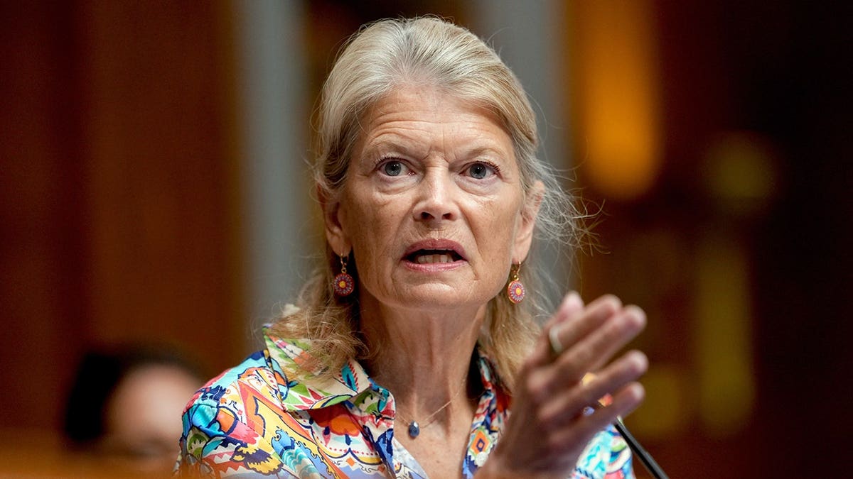 Murkowski gestures while speaking