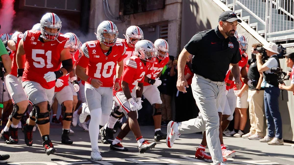 Ryan Day leads Ohio State onto the field in Columbus