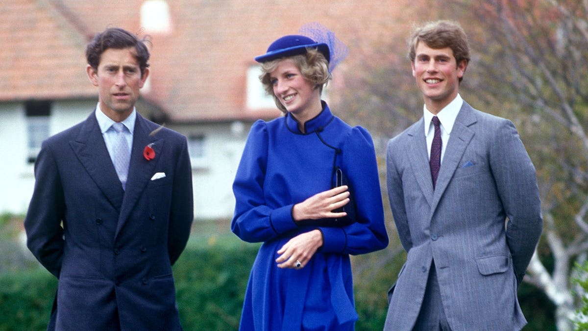 Diana, Princess of Wales, Prince Charles and Prince Edward stand together at Wanganui Collegiate.