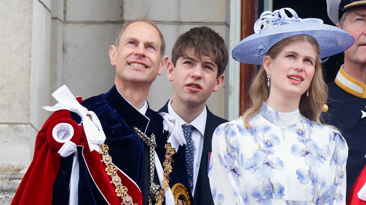 Prince Edward, James and Lady Louise Windsor watch an RAF flypast from Buckingham Palace balcony.