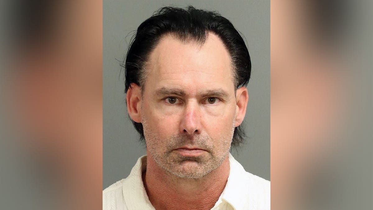 Booking photo of Randall Saunders Kerr, a North Carolina television news producer charged with felony stalking and violating a domestic violence protective order.