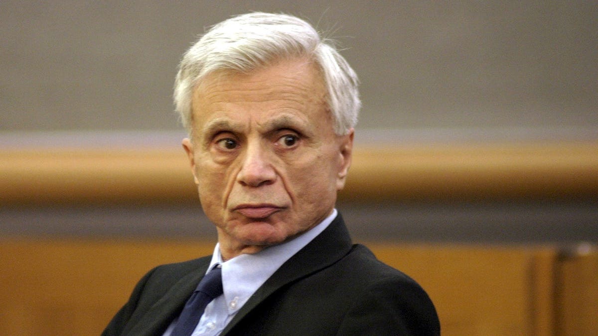 Robert Blake stands in court with his attorney M. Gerald Schwartzback in Los Angeles.