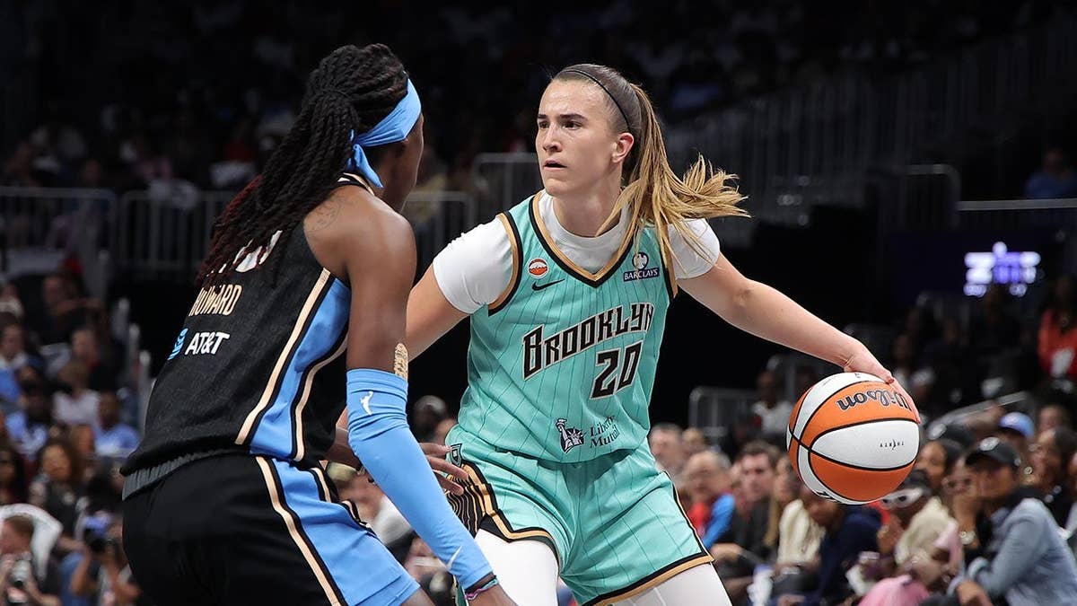 Sabrina Ionescu drives against Rhyne Howard during a WNBA playoff game in Atlanta
