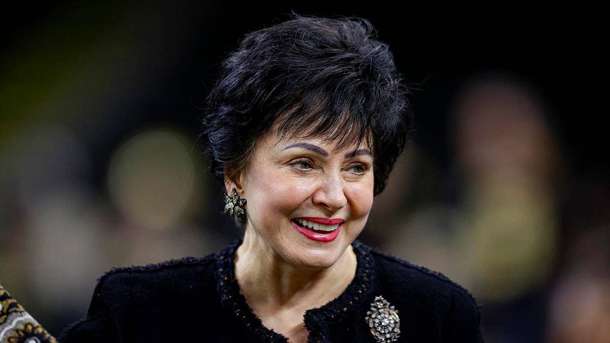 Gayle Benson walks on the field at Caesars Superdome