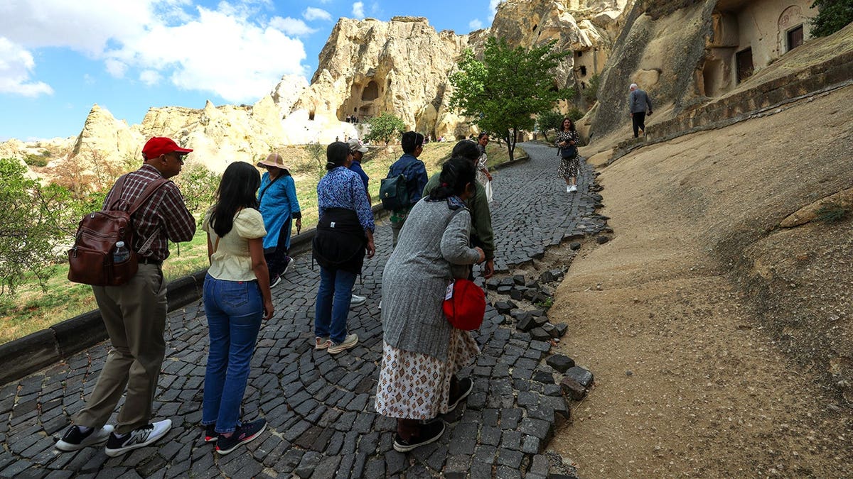 View of tourists at Gorene open air museum in Turkey