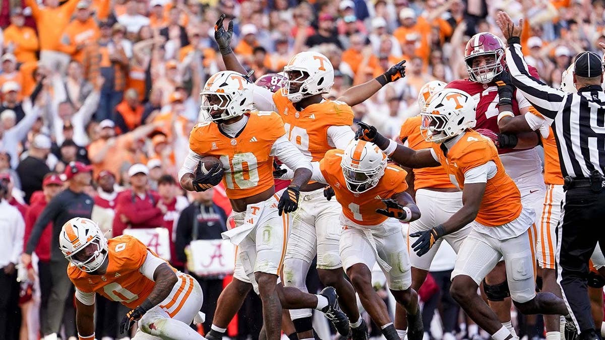 Dejuan Lane #10 celebrates after recovering the ball at Neyland Stadium.