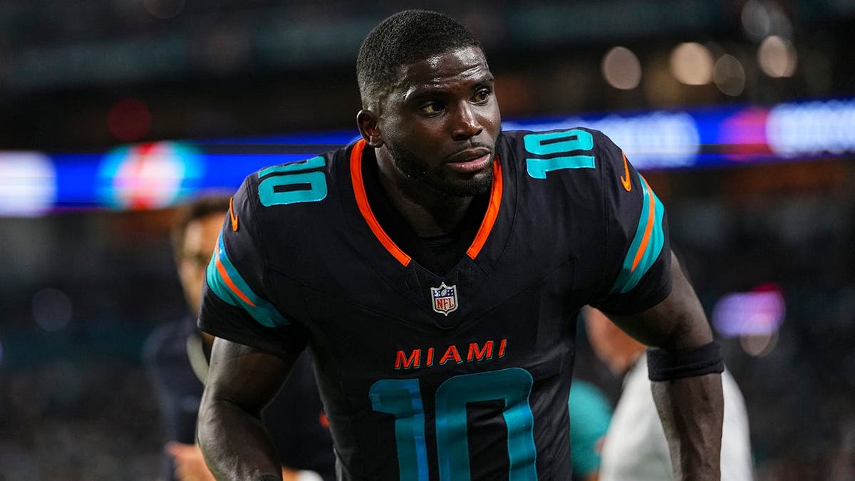 Tyreek Hill runs off the field at halftime.