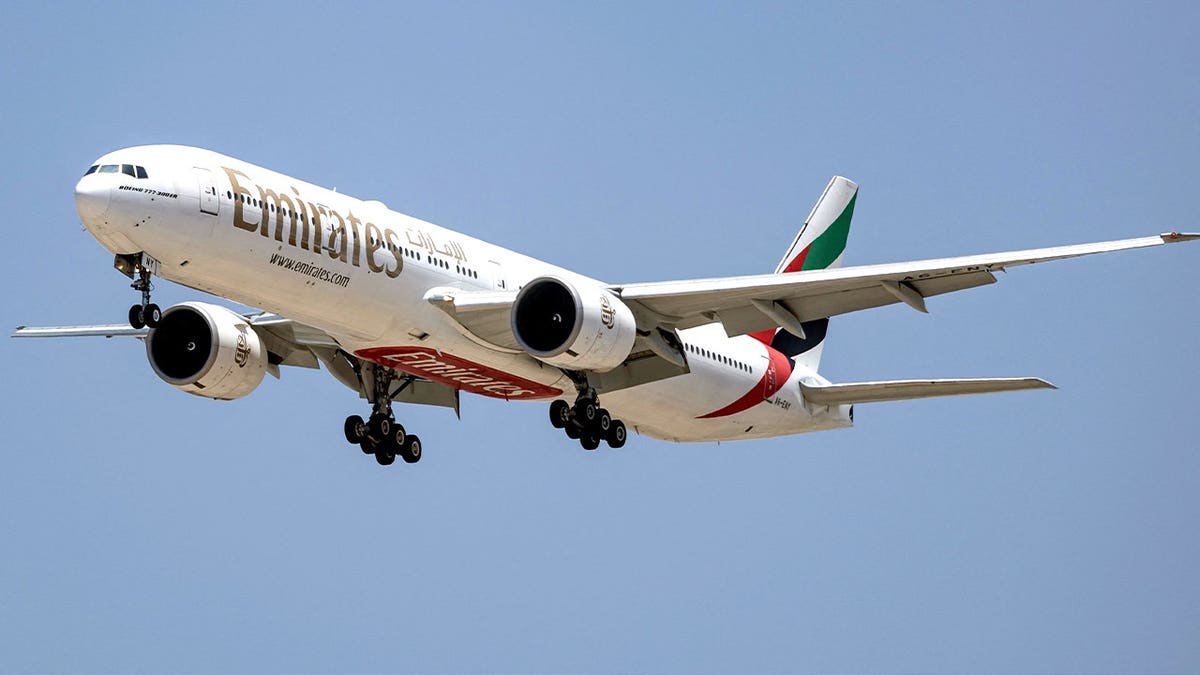 Emirates airplane in sky
