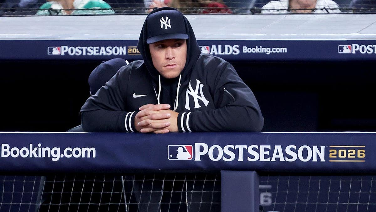 Aaron Judge watches from the dugout during Game 3 of the ALDS at Yankee Stadium.