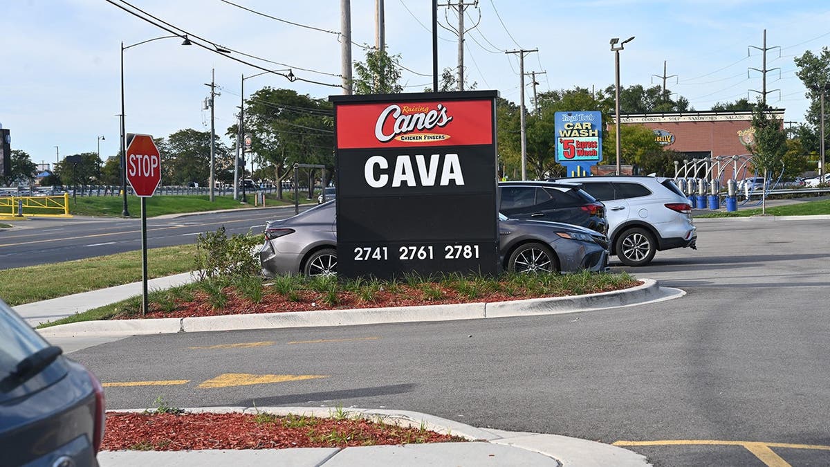 A sign that says Cava and Raising Cane's