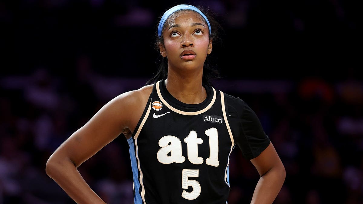 Angel Reese of the Atlanta Dream looks on during a game against the Los Angeles Sparks.