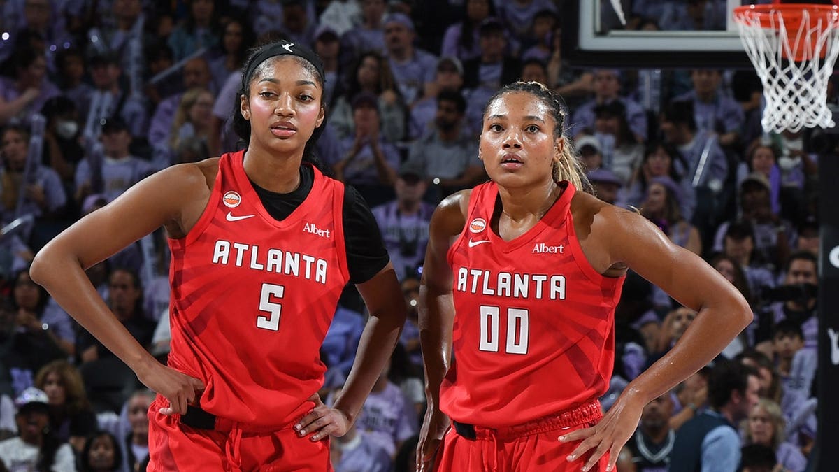 Angel Reese and Naz Hillmon of the Atlanta Dream look on during Game 1 of the 2026 WNBA Finals.