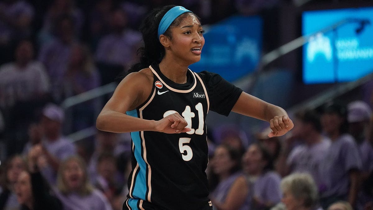 Angel Reese motions to referee during WNBA Finals game at Chase Center.