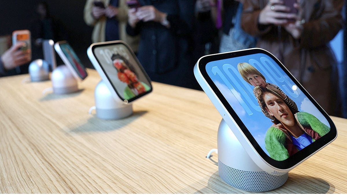 People view an Apple HomeView device at a product launch in New York City.