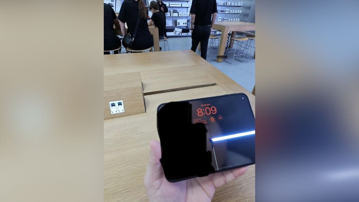 An iPhone Duo with a cracked screen