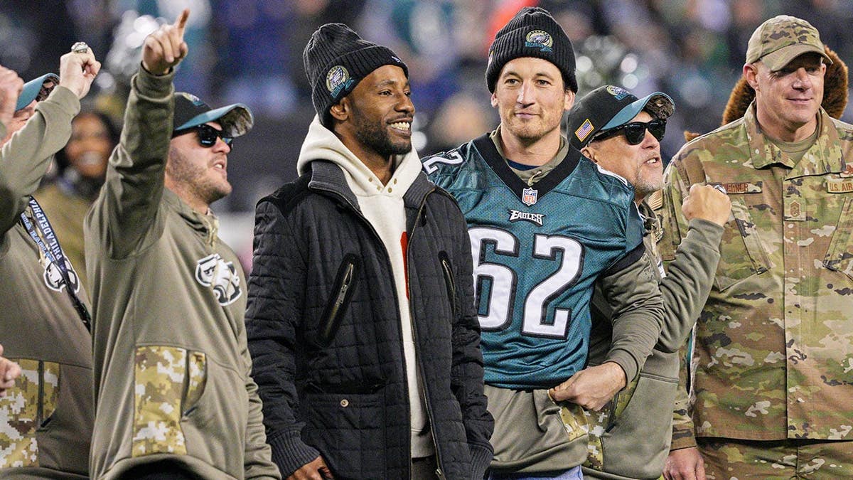 Asante Samuel and Miles Teller entertain fans during a Philadelphia Eagles game at Lincoln Financial Field.