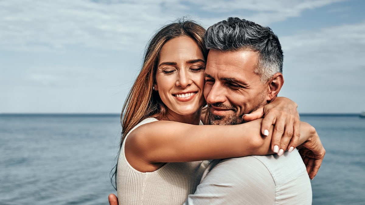 Attractive couple hugging
