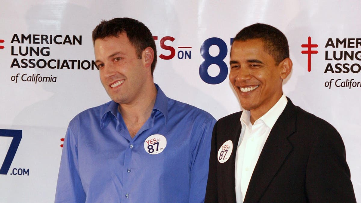 Ben Affleck and Barack Obama stand together.