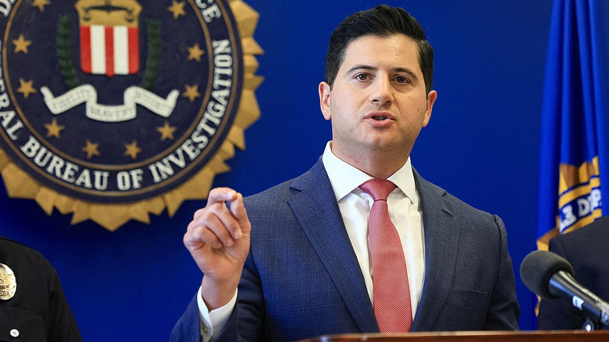 Bill Essayli speaks at FBI offices in Los Angeles during a law enforcement announcement.