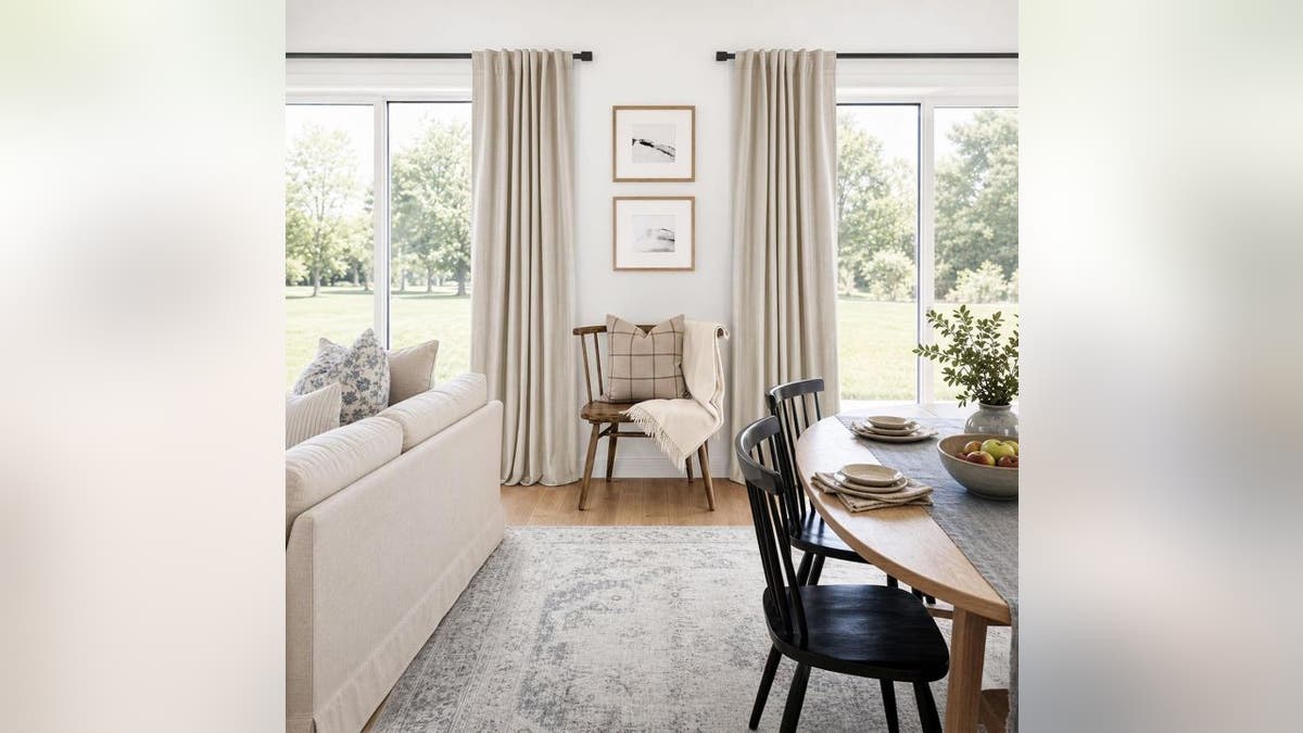 The two-panel set hangs easily and helps keep your room warm.