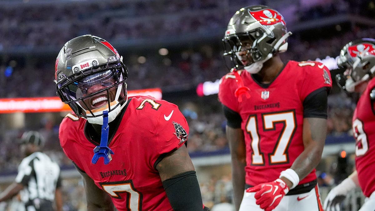 Bucky Irving, wearing Tampa Bay Buccaneers uniform number 7, celebrates after scoring a touchdown.