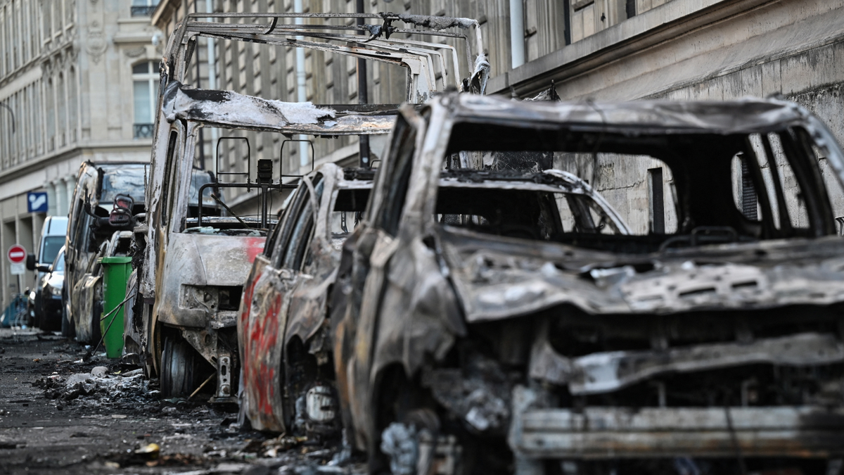 A photograph shows wreckages of burnt down vehicles in the street of Paris on October 18, 2026 a day after nationwide protests against the
