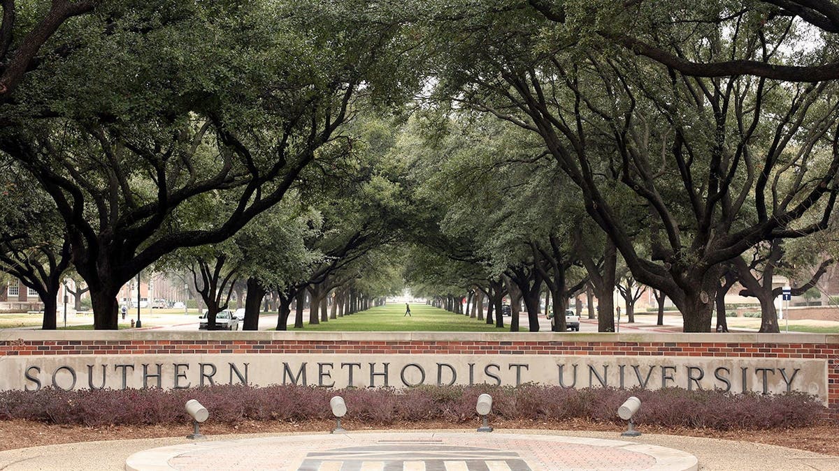 A student walking across the Southern Methodist University campus in Dallas.