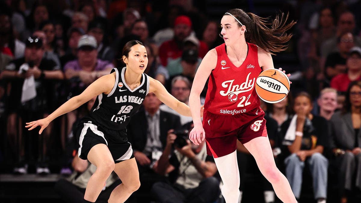 Caitlin Clark of the Indiana Fever looks to pass the ball during a WNBA playoff game.