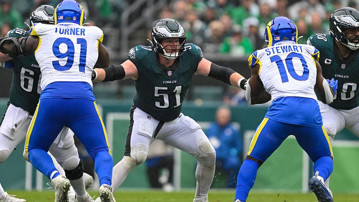 Cam Jurgens blocks during a game at Lincoln Financial Field.