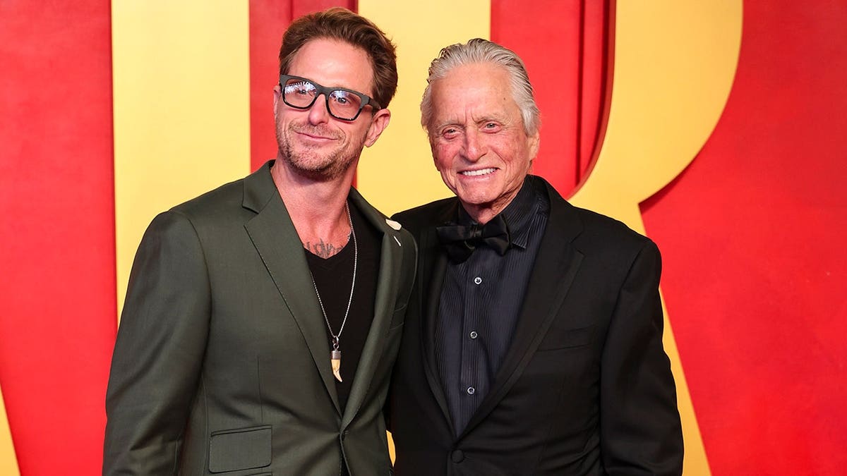 Cameron Douglas and Michael Douglas stand together at the 2024 Vanity Fair Oscar Party.
