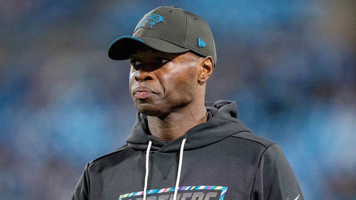 Ejiro Evero, Carolina Panthers defensive coordinator, looks on during an NFL game.