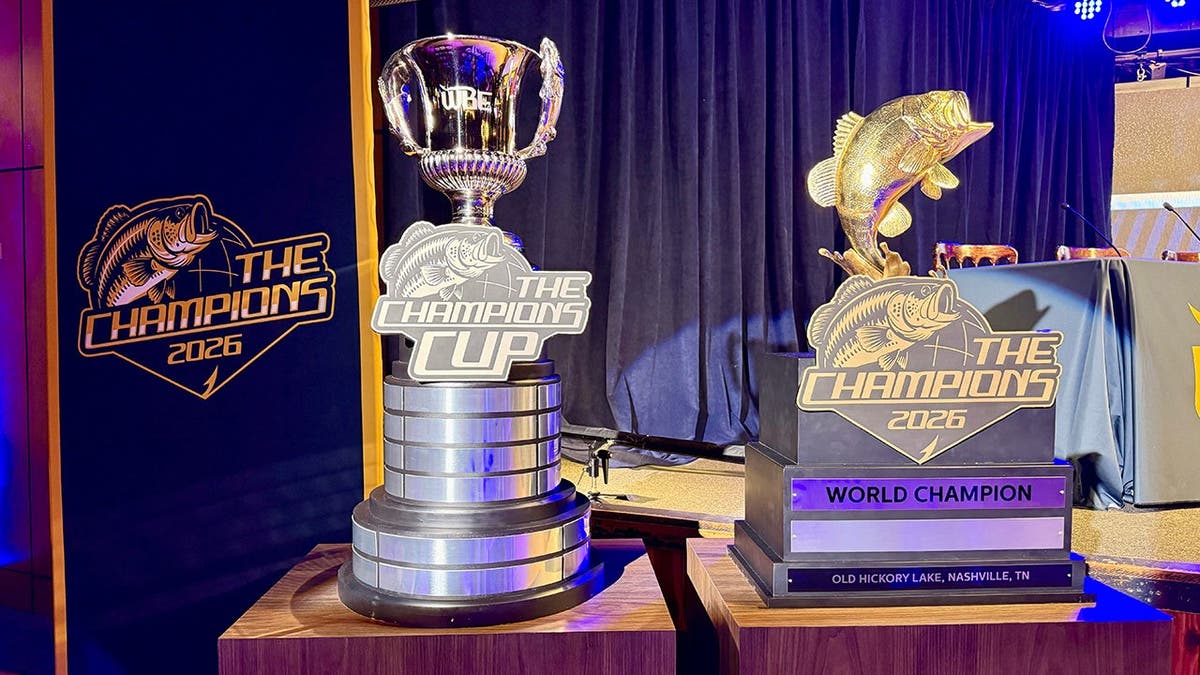 two trophies for The Champions bass fishing tournament