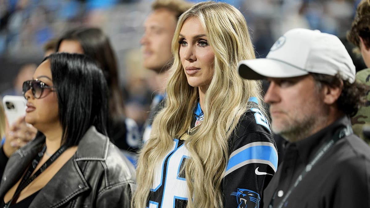 Charlotte Flair watches warmups before the Detroit Lions and Carolina Panthers game.