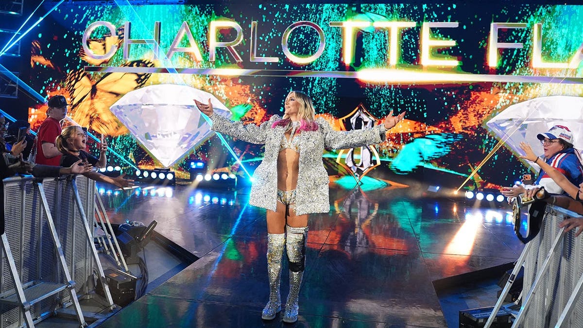 Charlotte Flair makes her entrance during SmackDown at Xfinity Mobile Arena.