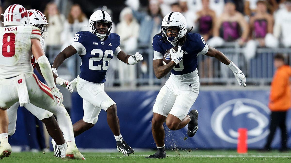 Chase Sowell, Penn State wide receiver, runs with the ball during a game.
