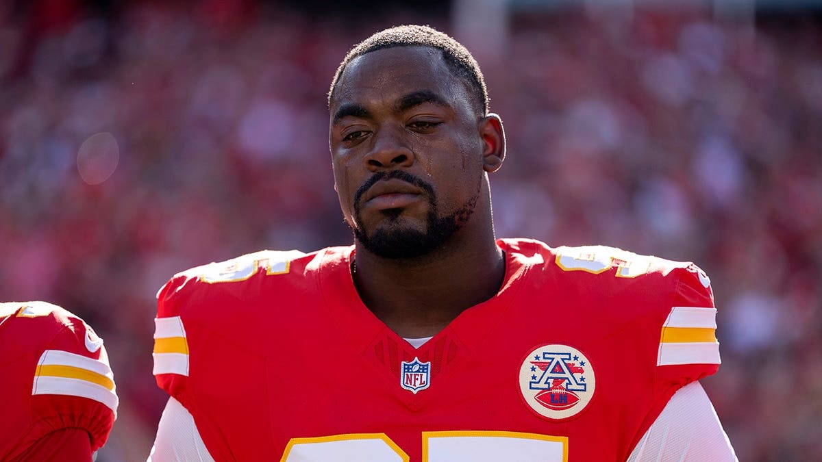 Chris Jones stands during the national anthem before an NFL game.