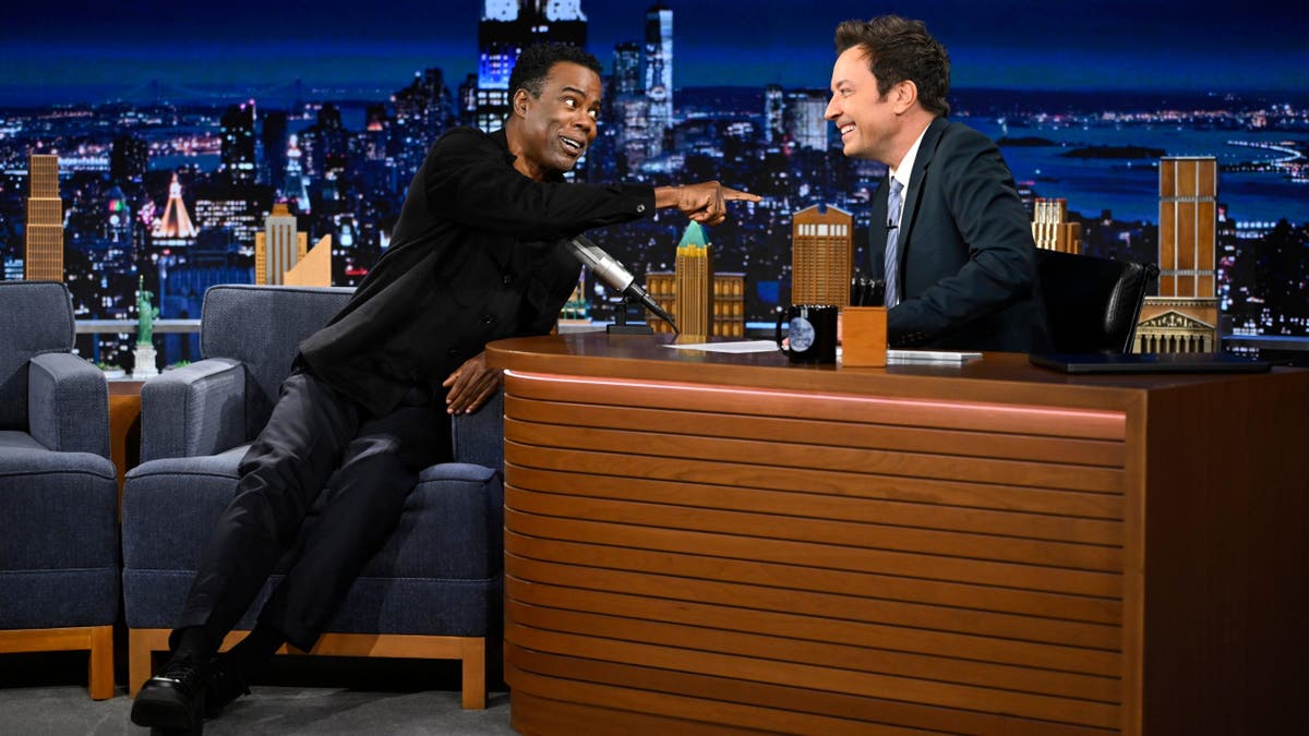 Chris Rock sits during an interview with Jimmy Fallon on The Tonight Show.