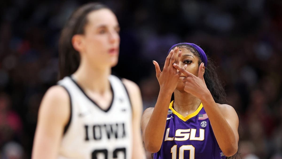 Angel Reese reacts toward Caitlin Clark during NCAA Women's Basketball Tournament championship game.