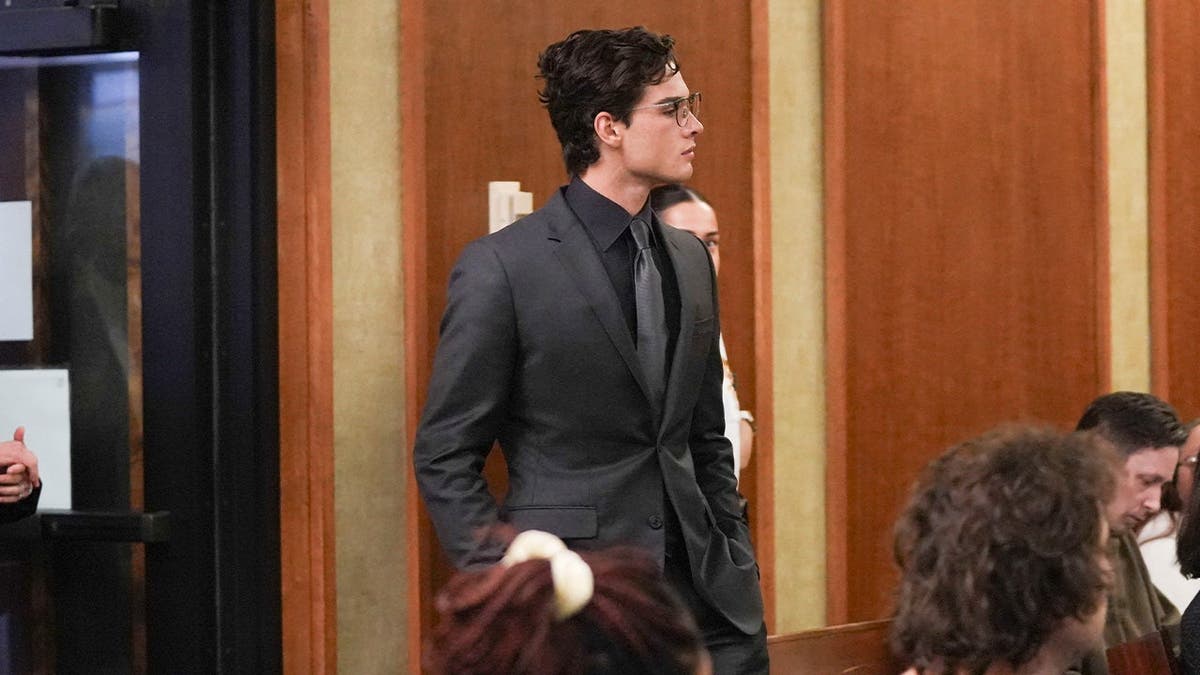 image shows defendant in courtroom