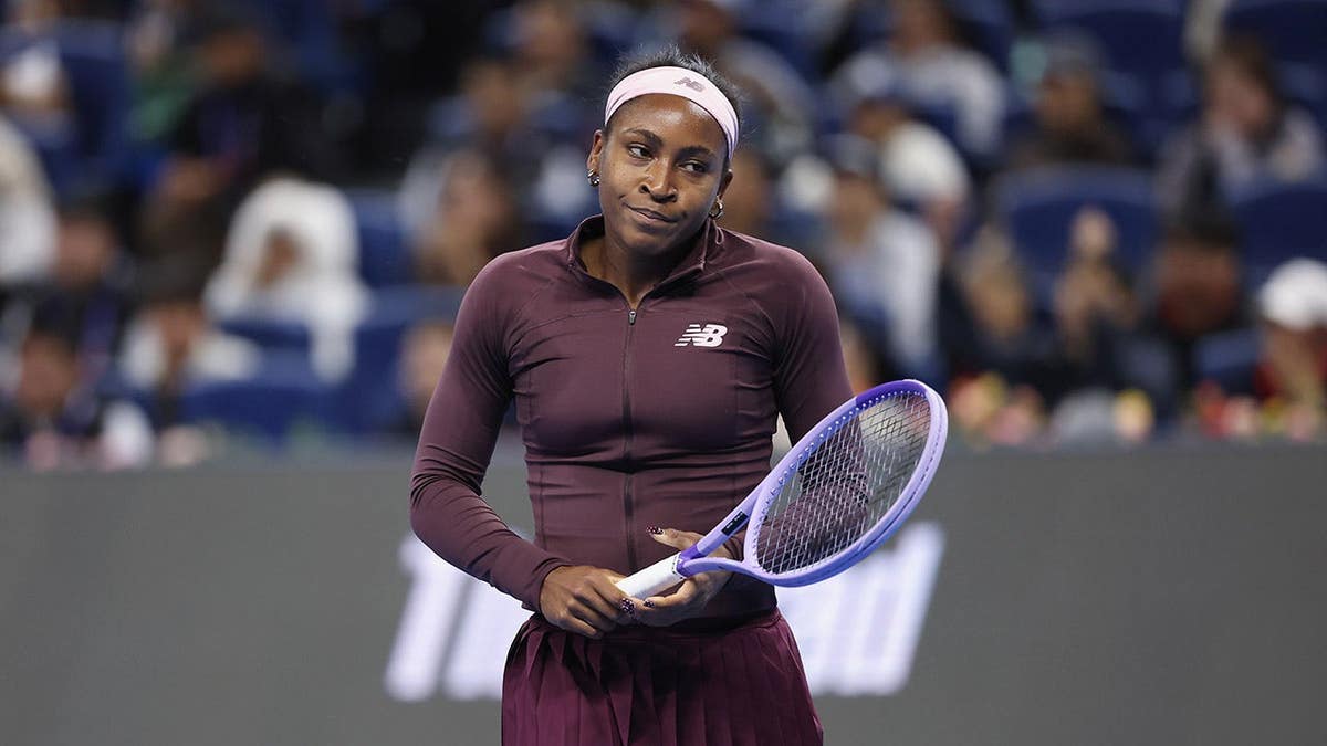 Coco Gauff reacts during a match against Xinran Sun in Beijing.
