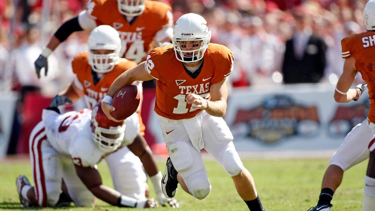 Colt McCoy runs during a Texas Longhorns game against Oklahoma at Cotton Bowl Stadium.
