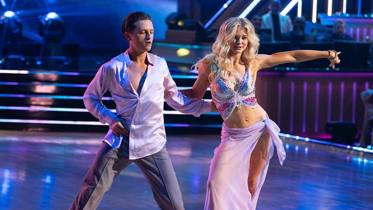 Connor Wood and Rylee Arnold dance together in the ballroom during Mariah Carey Night.