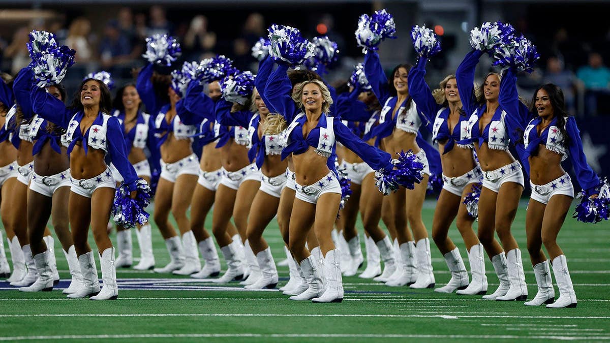 Dallas Cowboys Cheerleaders perform before a game at AT&T Stadium.